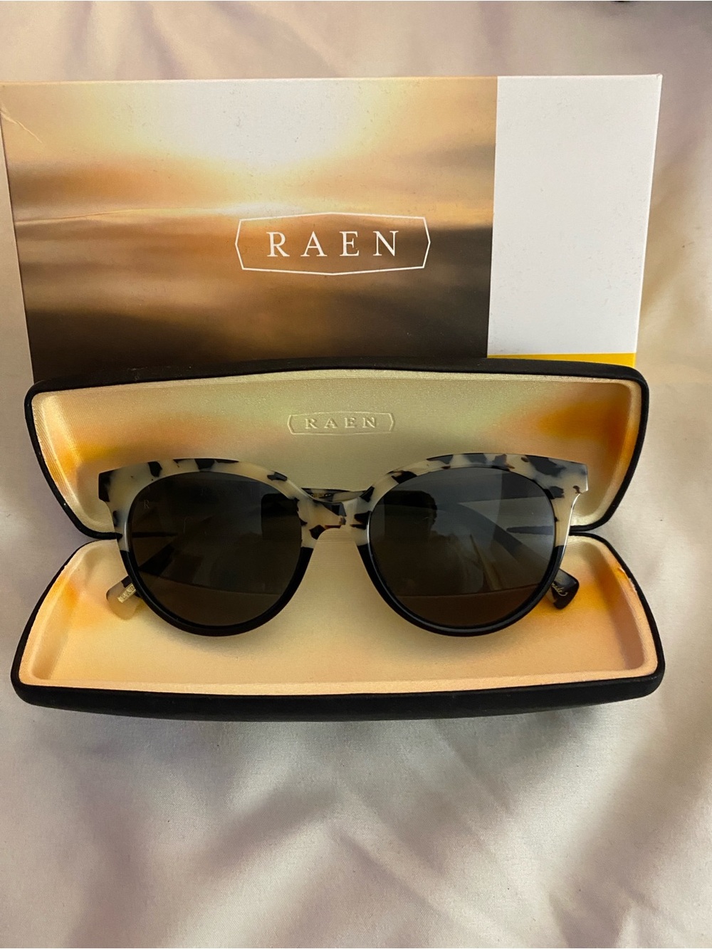 RAEN Women's Tortoiseshell Round Sunglasses - White/Black Frame with Gray Lenses